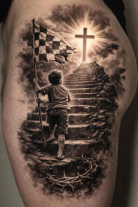 Black and grey realism tattoo of a boy climbing stone stairs toward a glowing cross on a hill; project idea, cover-up ready.