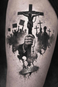 Crucifix on a dark cross tattoo in black and grey, project idea with multiple crosses; cover-up ready.