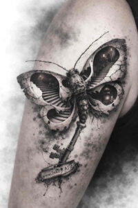 Butterfly on a branch, black and grey tattoo, project idea for a tattoo design.
